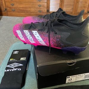 4 pcs Soccer Set!! Brand new cleats, 2 pairs of socks & 1 pair of shin guards.